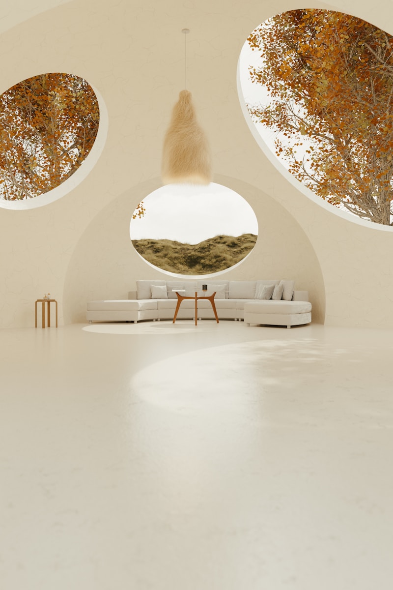 A room with three circular windows and a couch